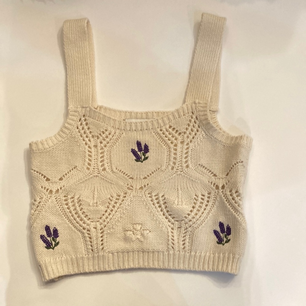 I am listing a beige top with lavenders that looks knitted it is a size  xs